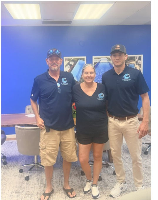 AnnDee Bennett with family in Blue Plunge Pools shirts.